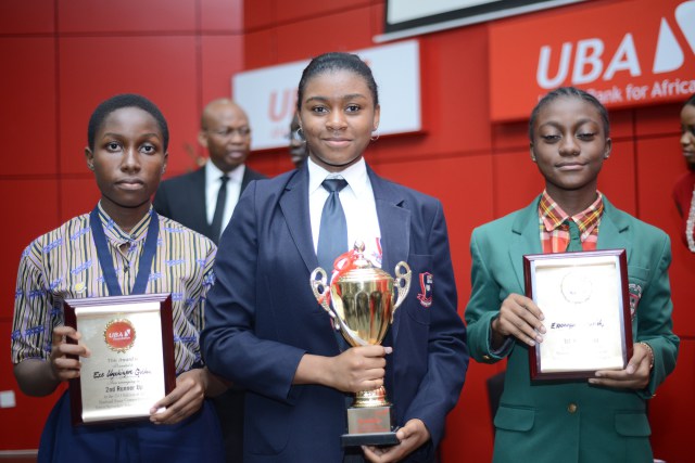 L-R: Overall Winner of the UBA Foundation National Essay Competition for secondary schools, Miss Emediong Uduak Uko of British Nigerian Academy, Abuja (middle) flanked by 2nd prize winner Miss Enonuoya Starish of Lagoon School Lagos (right) and 3rd prize winner Miss Eze Ugochinyere Golden of Living World Academy Aba, during the Grand finale and prize giving ceremony held at UBA House in Lagos on Monday