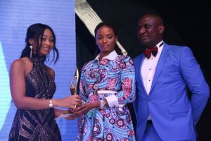 Thelma Chukwu of Nestoil presenting award for best company in CSR Sustainability, West Africa to Ijeoma Aso, Managing Director, UBA Foundation while Olusegun Fafore, Corporate Communications Manager, Nest Oil,  looks on...at the 2016 SERAS CSR Awards -Africa in Lagos, during the weekend.  