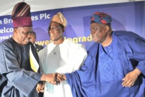 FROM LEFT TO RIGHT – Governor Ibikunle Amosun of Ogun State receiving a bouquet of flowers as he arrived for the commissioning of the upgraded  Ota Brewery on Wednesday. With him are the Chairman, Nigerian Breweries Plc, Chief Kola Jamodu (second left); Corporate Affairs Adviser, Nigerian Breweries Plc, Mr. Kufre Ekanem, (first from left) and Otunba Bimbo Ashiru, Ogun State Commissioner for Commerce and Industry.